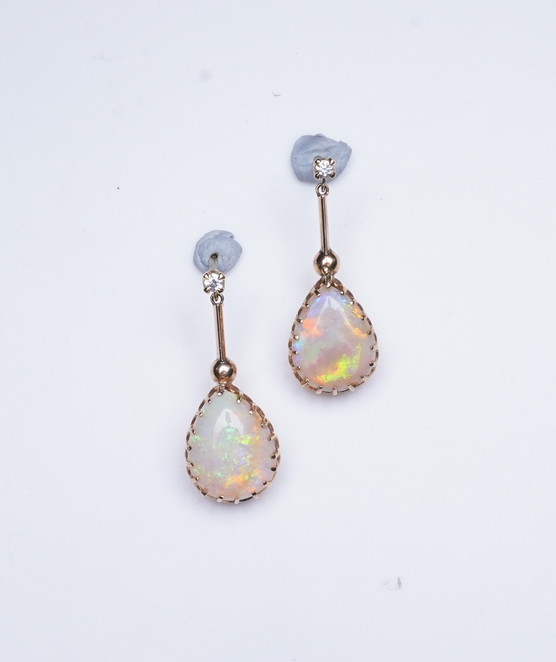 A pair of opal and diamond earrings